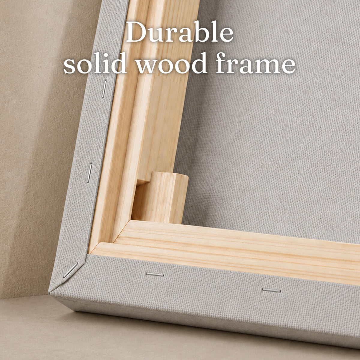 Close-up of the canvas back corner showing the solid wood stretcher bar frame and staple construction